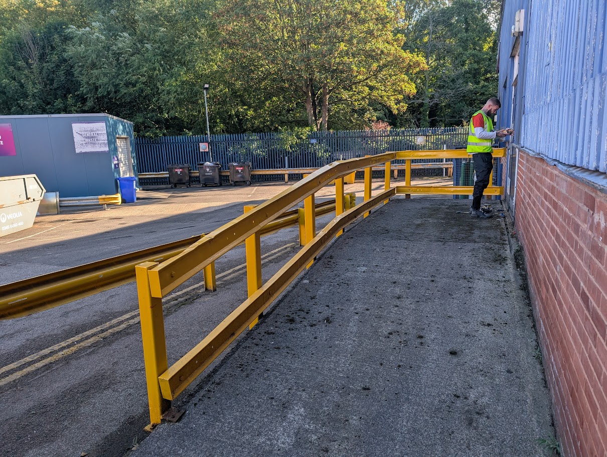 Installing security bollards to protect a commercial entrance