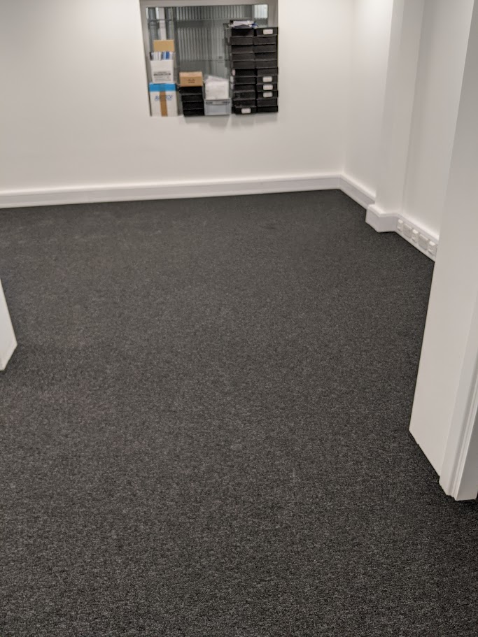 Installing carpet tiles in a Sheffield office