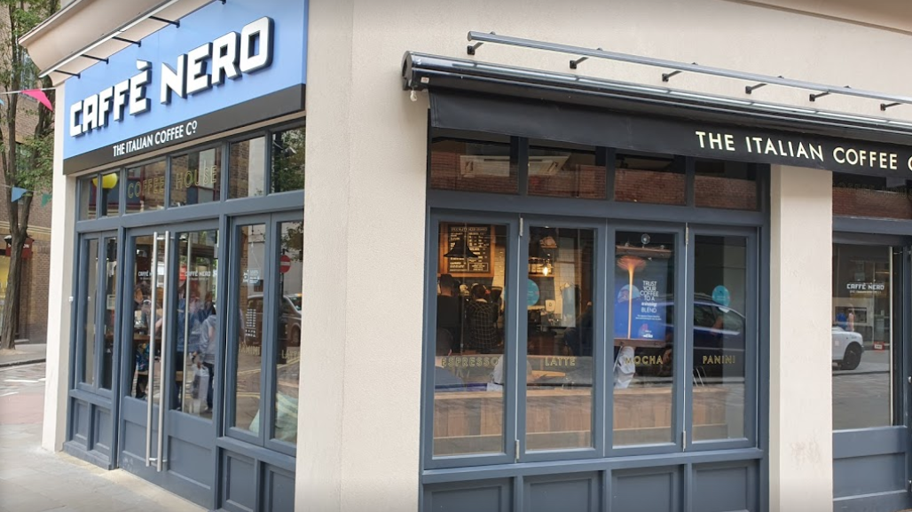 Commercial painters decorating an exterior shop front in Sheffield