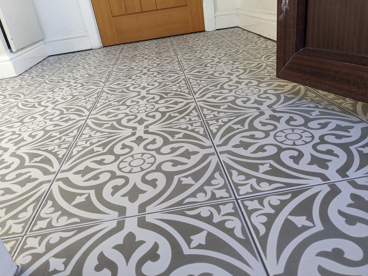 Commercial floor tiling being installed with neat spacing and alignment