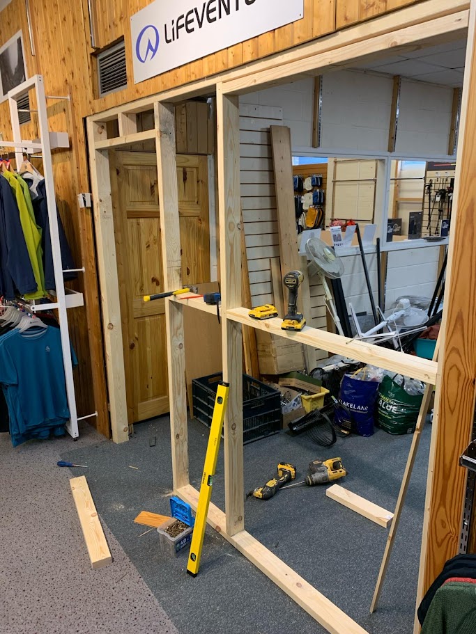 Commercial joiner installing an internal door frame on a refurbishment project in Sheffield