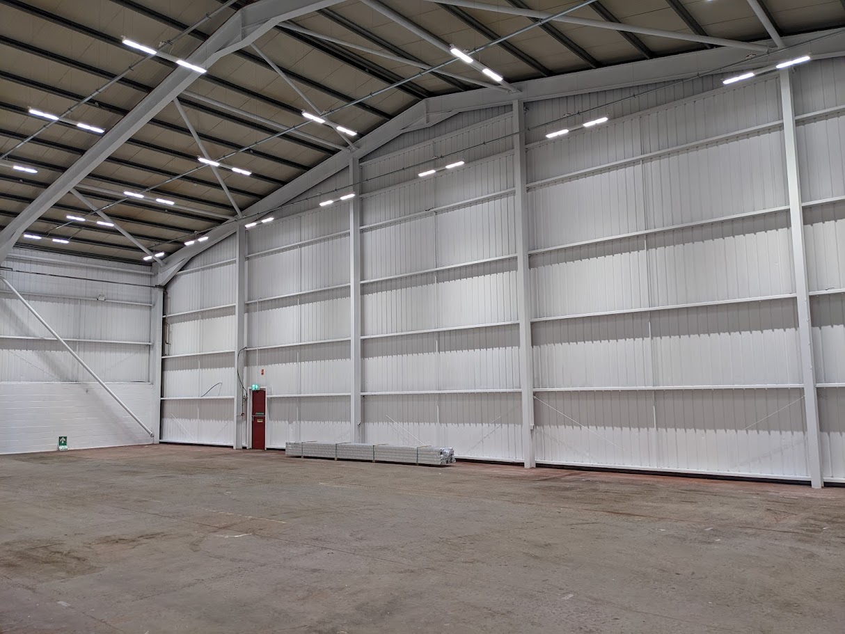 Finished spray painted commercial interior with clean consistent coverage