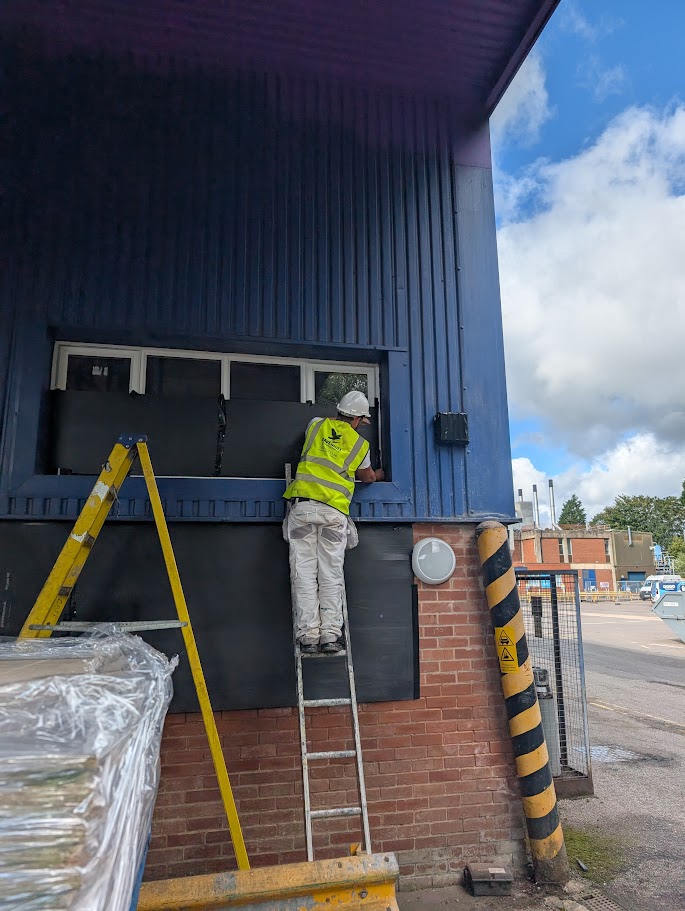 Contractor prepping area wearing hi-vis