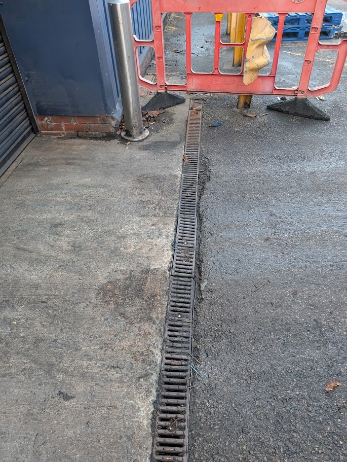 Installing or repairing drainage channels to improve water run-off