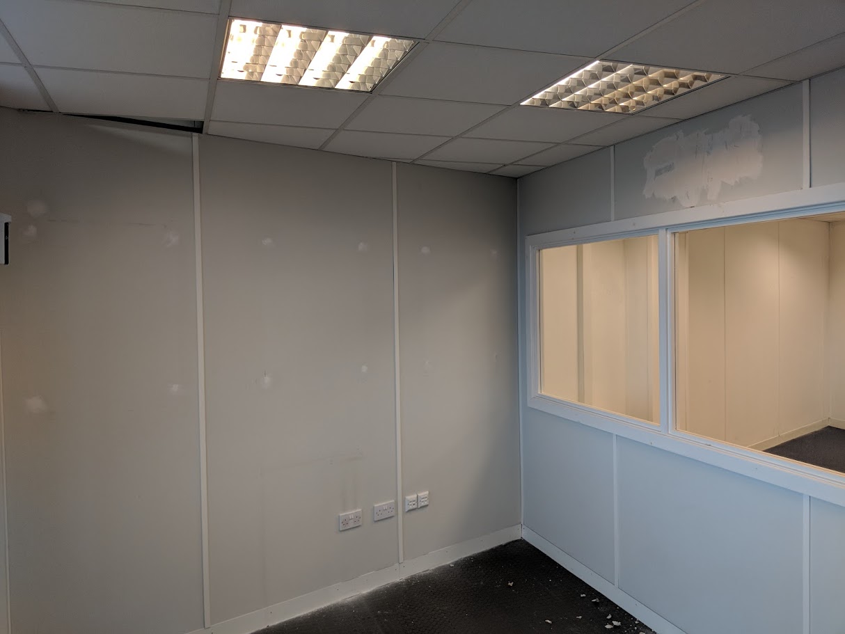 Dry lining boards being installed in a commercial refurbishment