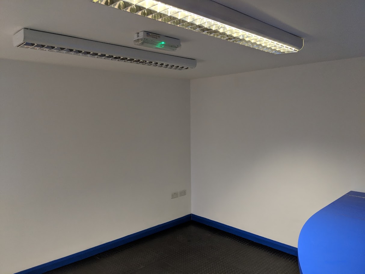 Installing emergency lighting in a commercial corridor
