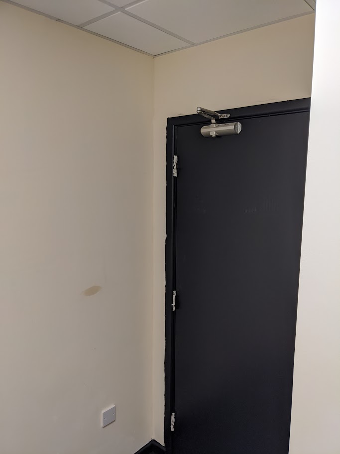 Installing a fire door set in a commercial building in Sheffield
