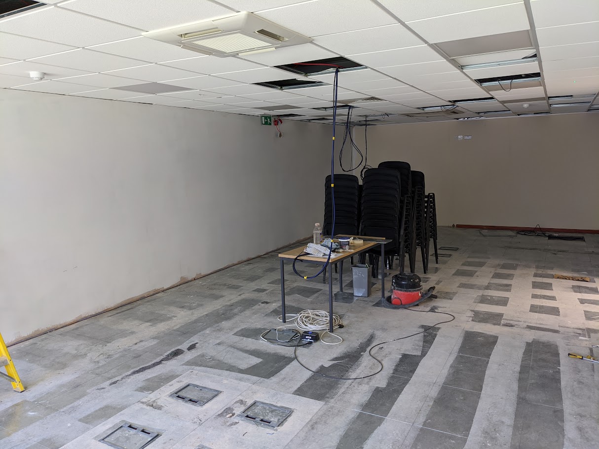 Metal framing for an MF ceiling system being installed in a commercial unit