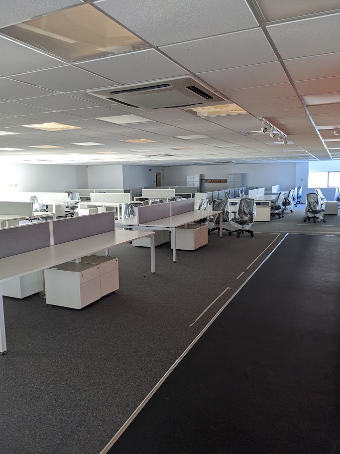 Suspended ceiling grid installation during a commercial office fit out project