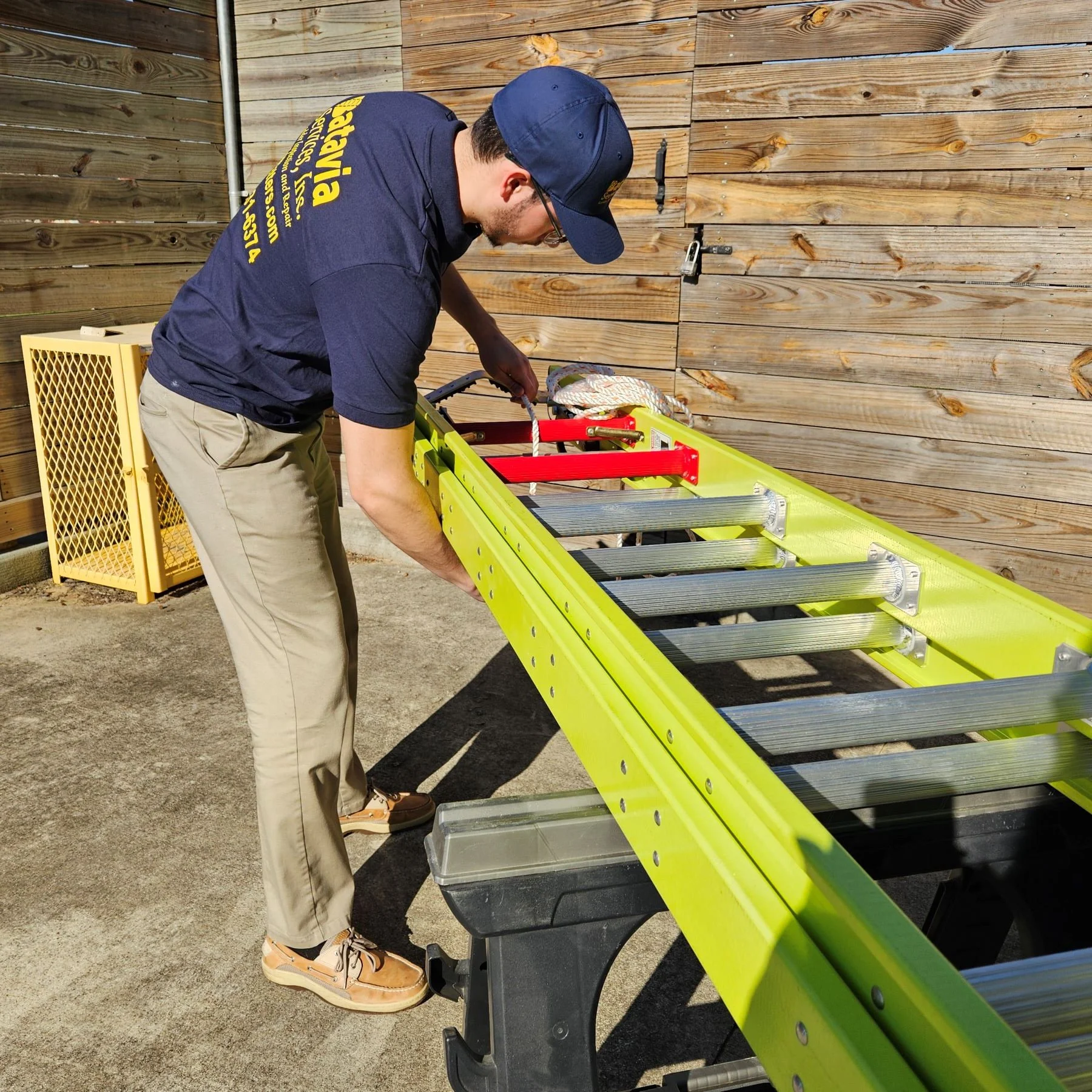 Commercial property maintenance contractor repairing ceiling