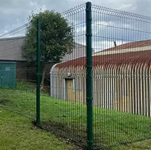 Commercial security fencing installation around industrial site