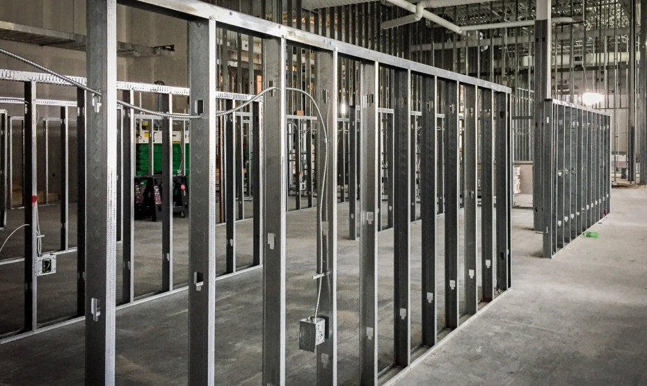 Drylining contractors installing metal stud partition walls