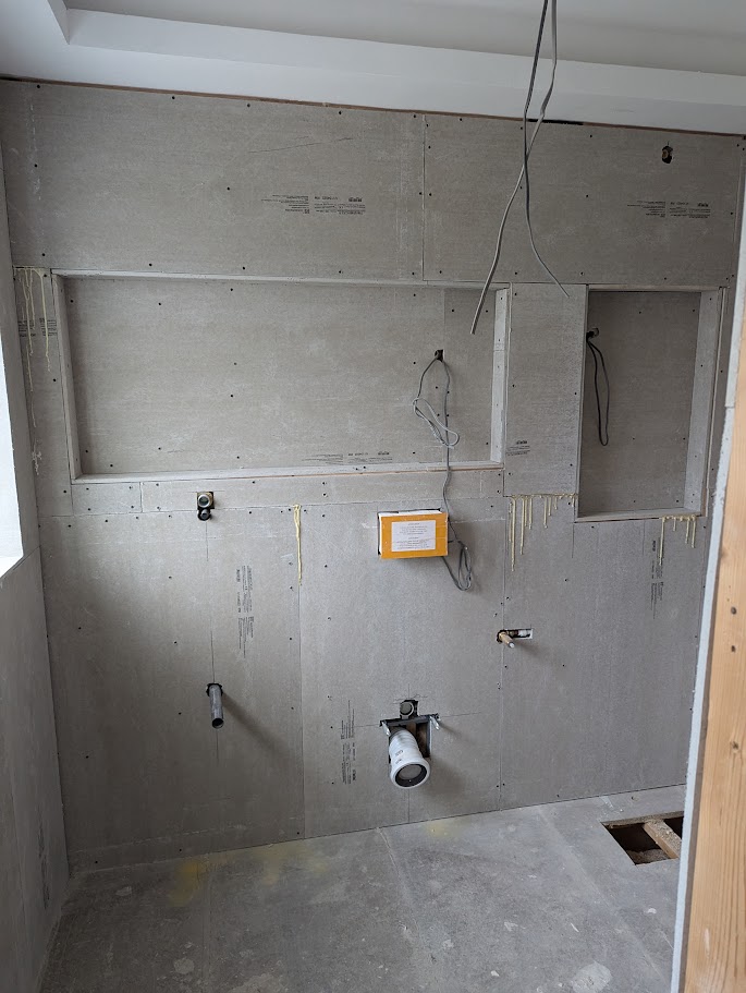 Preparing walls with boarding before commercial tiling installation