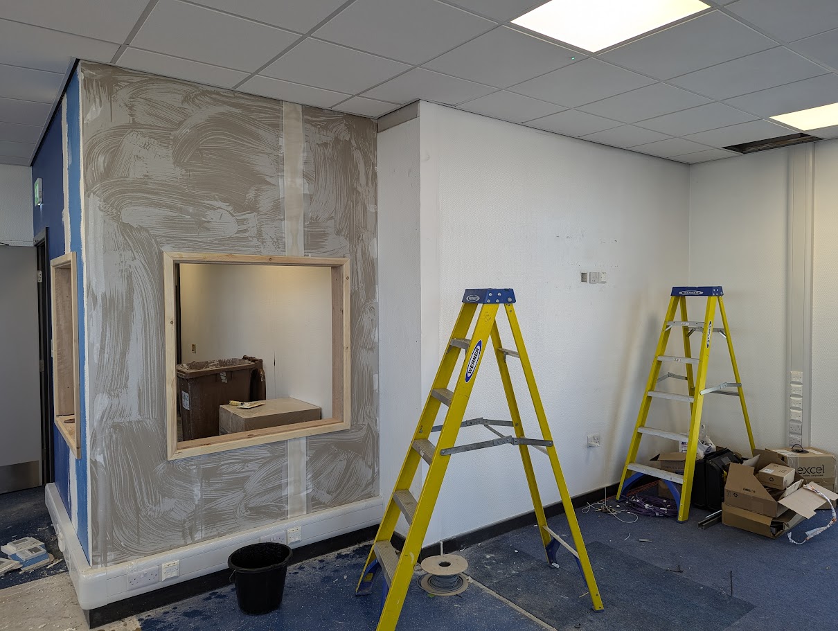 Preparing walls and installing lining paper prior to commercial wallcoverings