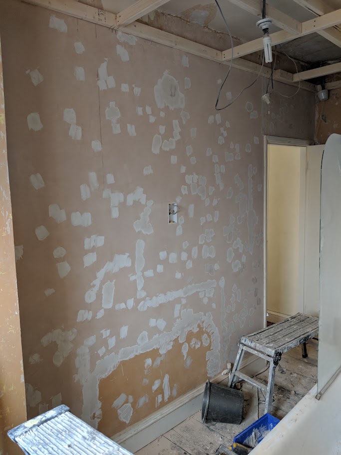 Worn and marked office walls before redecorating